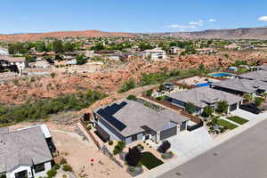 Aerial perspective of suburban area with a mountain backdrop