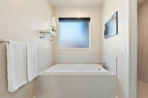 Full bath featuring a bath