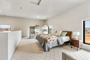 Bedroom featuring light colored carpet, baseboards, and recessed lighting