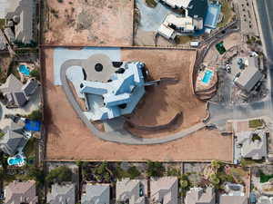 Aerial view of property's location with nearby suburban area and a pool area