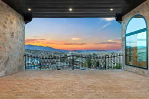 Patio terrace at dusk with a mountain view