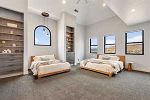 Bedroom with baseboards, dark colored carpet, recessed lighting, and high vaulted ceiling
