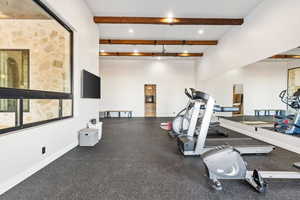 Exercise area with baseboards and recessed lighting