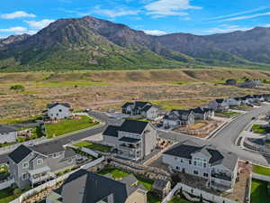 Aerial view of residential area featuring a mountain backdrop