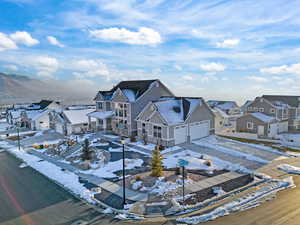 Snowy aerial view with a residential view
