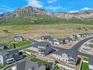 View of mountain backdrop featuring nearby suburban area