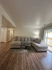 Living area with dark wood-type flooring