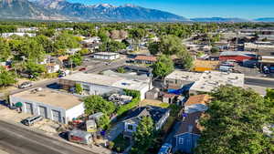 Aerial view of residential area featuring a mountainous background