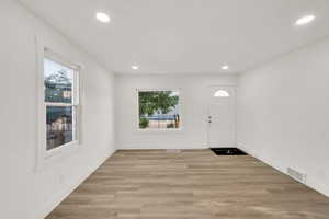 Foyer featuring recessed lighting and light wood-style floors