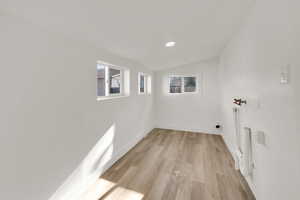 Laundry room with light wood-style flooring and washer hookup