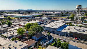 Aerial view of an industrial area and a mountainous background