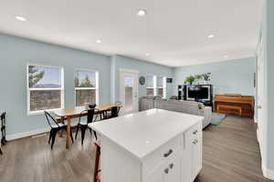Open kitchen to family room floor plan and additional gathering space on the deck.