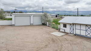 Detached garage featuring a mountain view