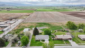 View of rural area featuring rows of crops and mountains