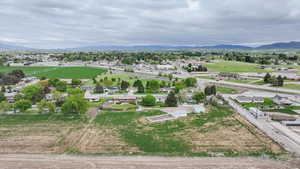 Aerial view of residential area featuring a mountainous background