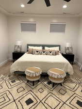 Bedroom with light wood-type flooring, baseboards, recessed lighting, and a ceiling fan