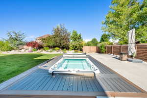 View of swimming pool with a deck