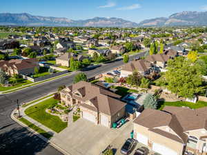 Aerial perspective of suburban area featuring a mountainous background