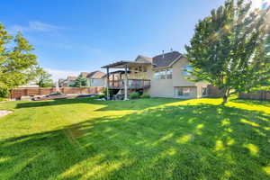 View of yard featuring a pergola and a deck