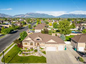 Aerial perspective of suburban area featuring a mountainous background