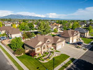 Aerial perspective of suburban area featuring a mountainous background