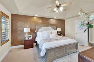 Bedroom featuring baseboards, carpet flooring, vaulted ceiling, a ceiling fan, and recessed lighting