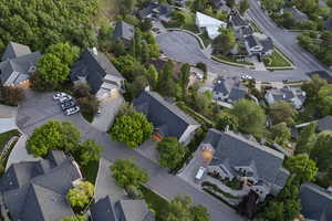 Aerial view of property and surrounding area with nearby suburban area