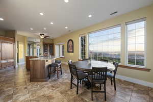 Dining room featuring recessed lighting, baseboards, a ceiling fan, and light tile patterned floors