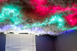 Kids play area or mood room featuring new LVP flooring and baseboards, adjustable mood lighting on the ceiling