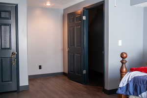Bedroom with a textured ceiling, baseboards, and new LVP flooring