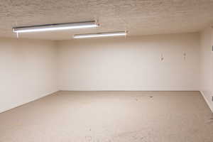 Kids play area or storage room with baseboards