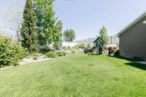 View of yard with a playground
