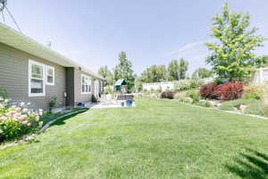 View of yard with a patio area