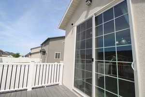 View of deck and sliding back door