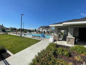 Community pool featuring a patio and bathrooms