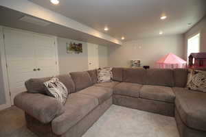 Living area featuring carpet flooring and recessed lighting