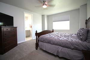 Carpeted Primary bedroom featuring connected primary bathroom