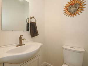 Bathroom featuring toilet and vanity