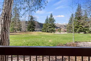 View of grassy yard with a Deer Valley mountain view