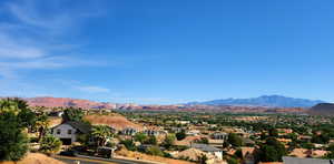View of mountain background featuring nearby suburban area