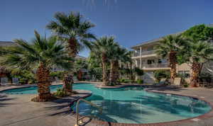 Community pool featuring a patio