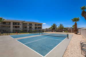 View of tennis court featuring community basketball court