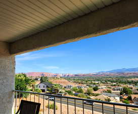 Balcony with a mountain view and a residential view