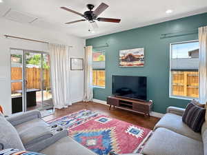Living room with attic access, recessed lighting, baseboards, and ceiling fan