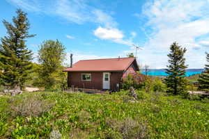 View of property exterior with metal roof