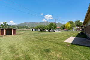 View of grassy yard featuring a mountain view