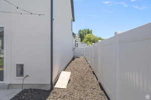 View of home's exterior with a fenced backyard and stucco siding