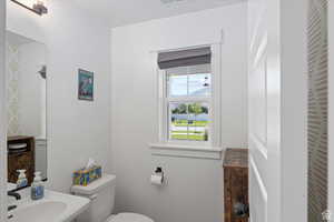 Bathroom featuring toilet and a sink