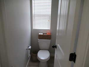 Bathroom with baseboards and toilet