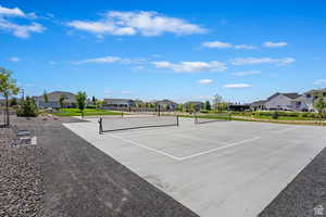 View of pickeball court with a residential view